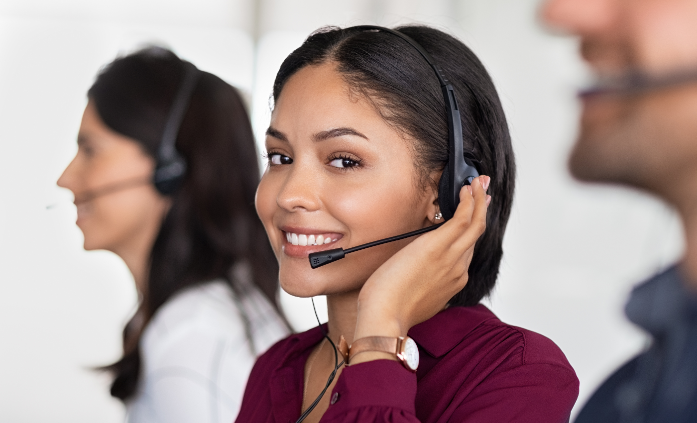 Woman wearing headset in a call center answering calls from shareholders and customers