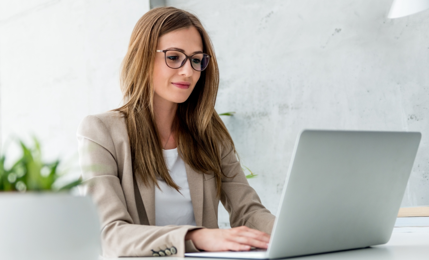 Business woman typing on computer
