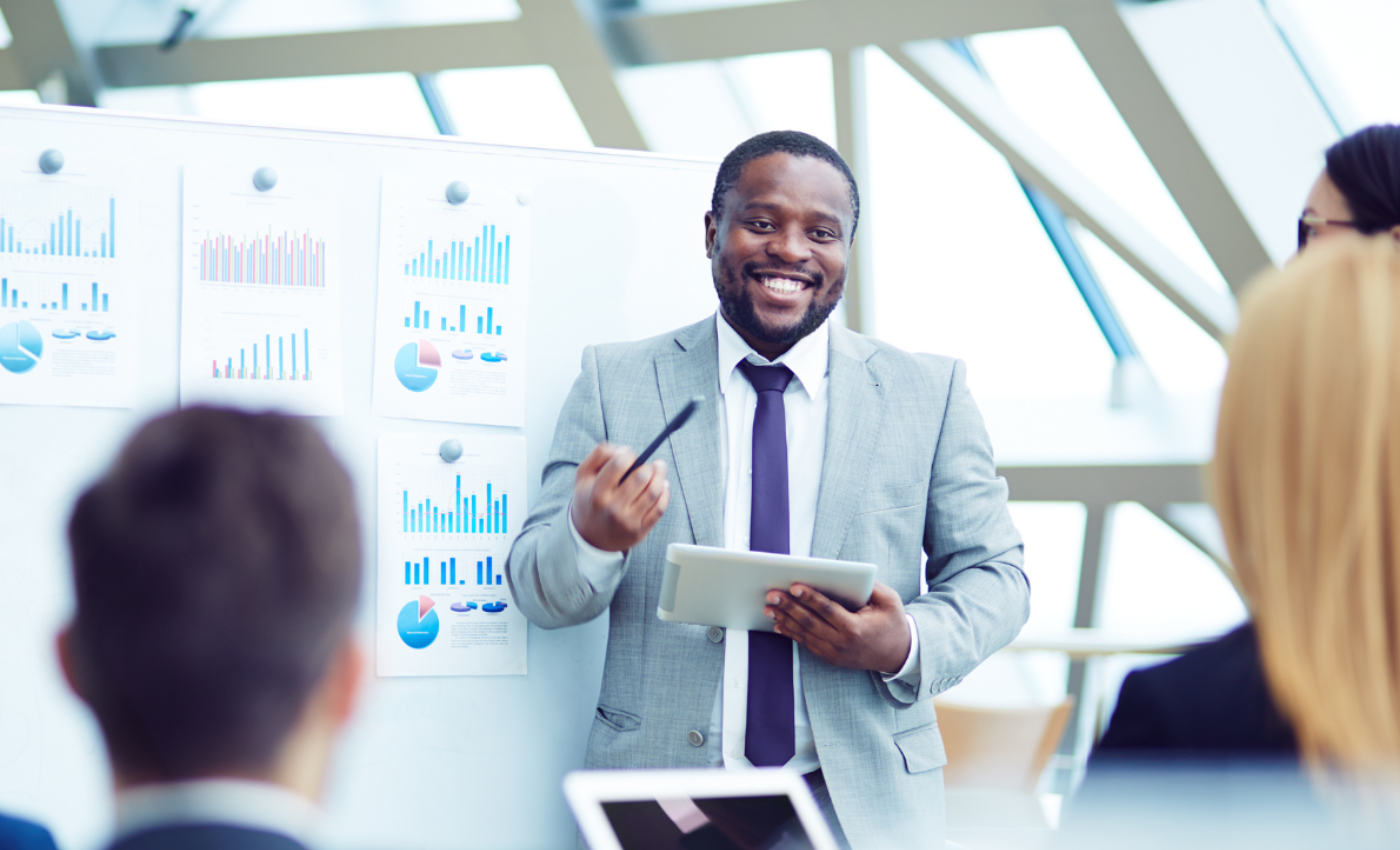 Businessman presenting graphs in conference meeting